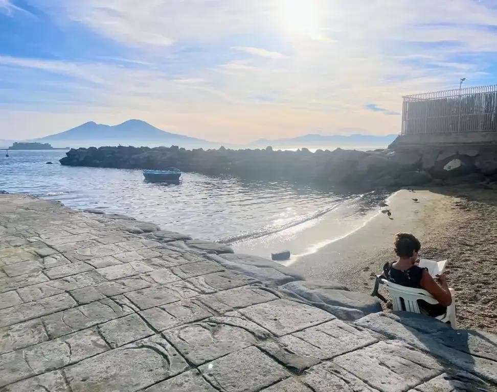 Woman on the beach reading
